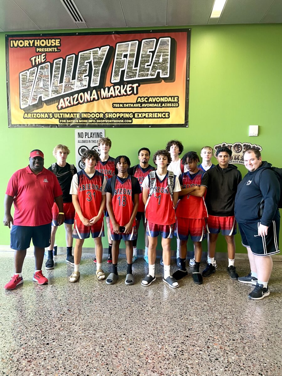 group of basketball players with their coaches after a tournament